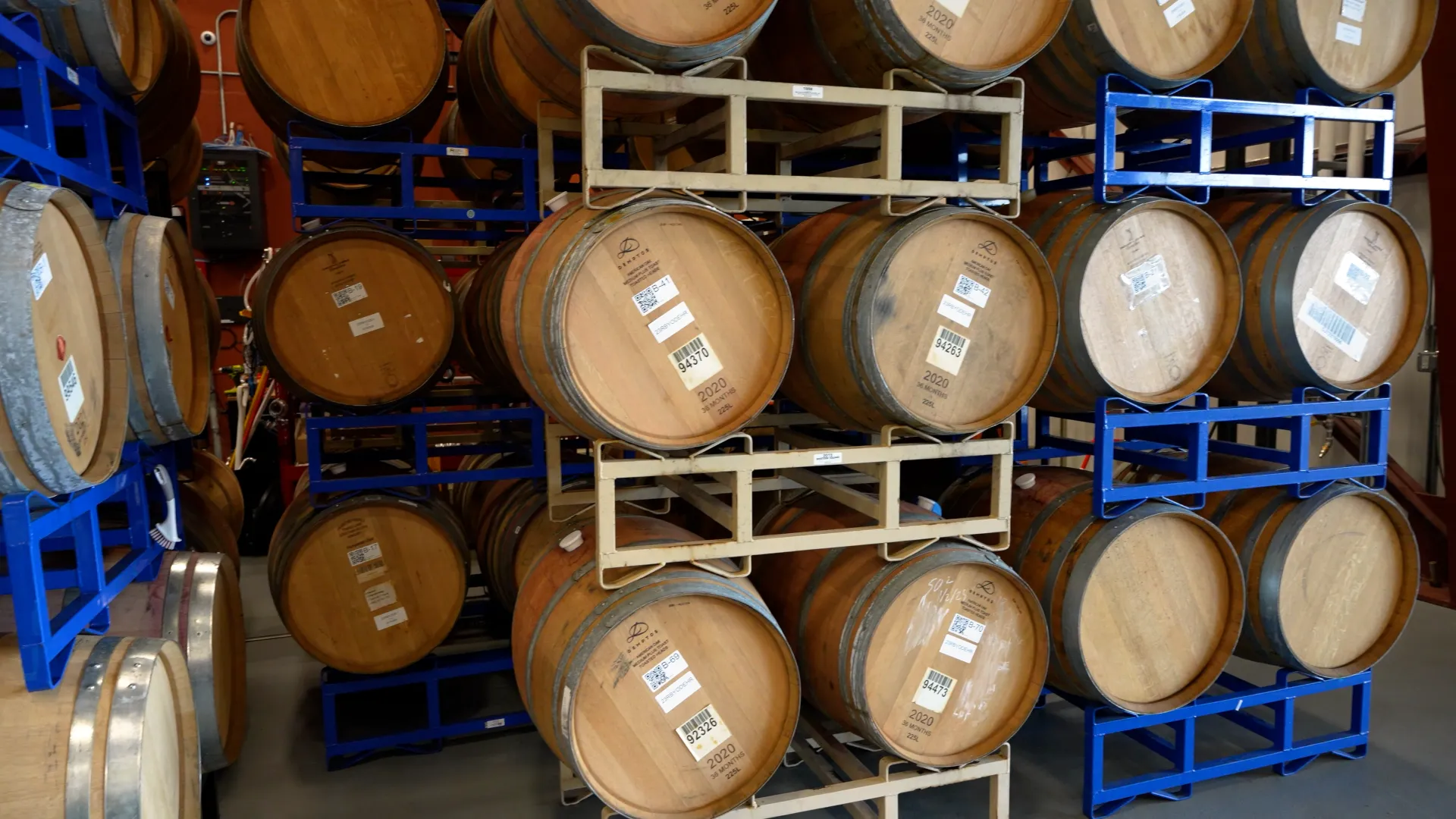 Wine ageing in wooden barrels at purple sky winery.