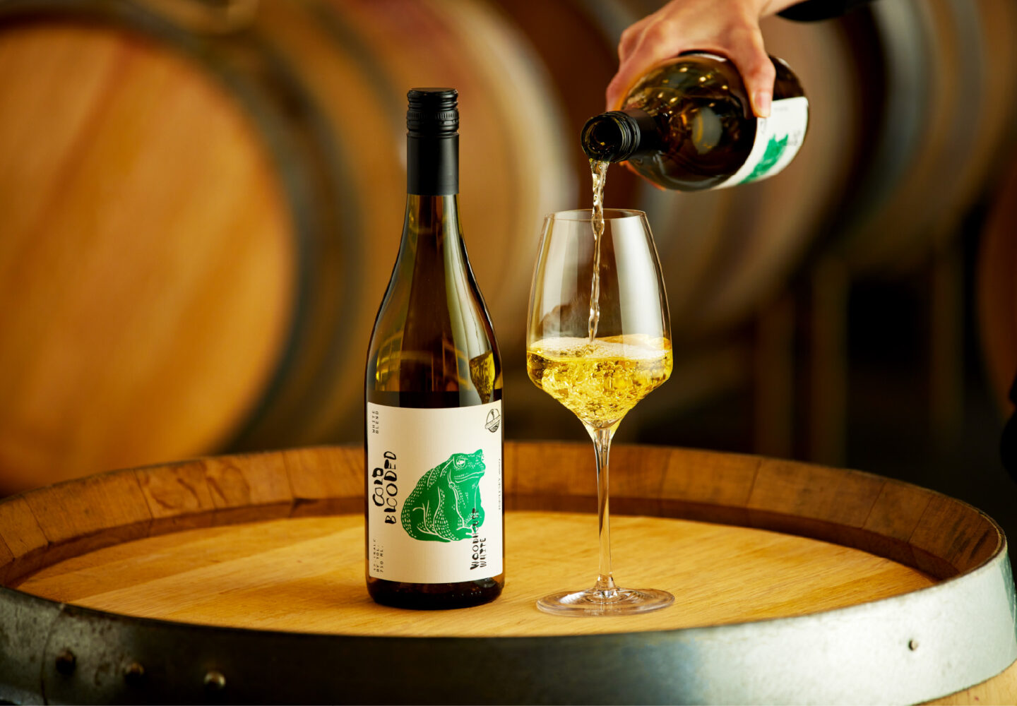 Purple sky winery bottle of 2024 woodhouse white with glass being poured.