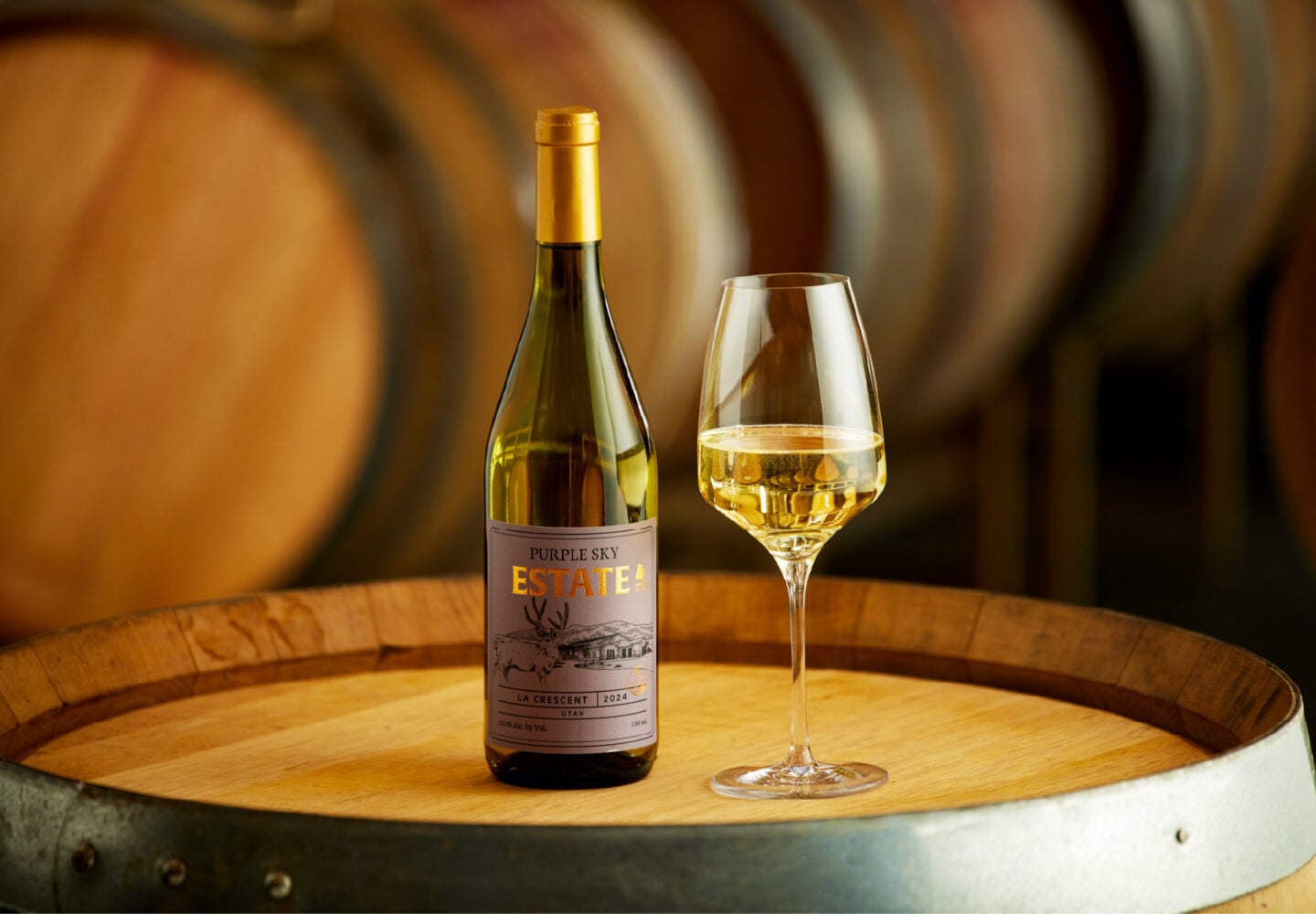 Purple sky winery bottle of 2024 la crescent with glass being poured.