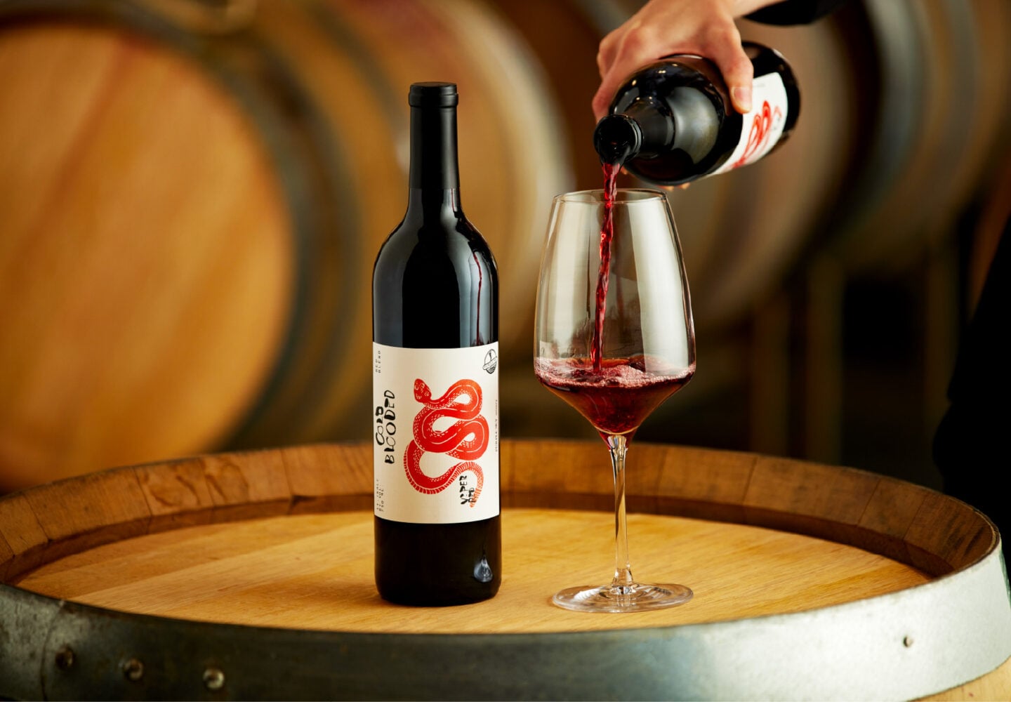 Purple sky winery bottle of 2024 viper red with glass being poured.
