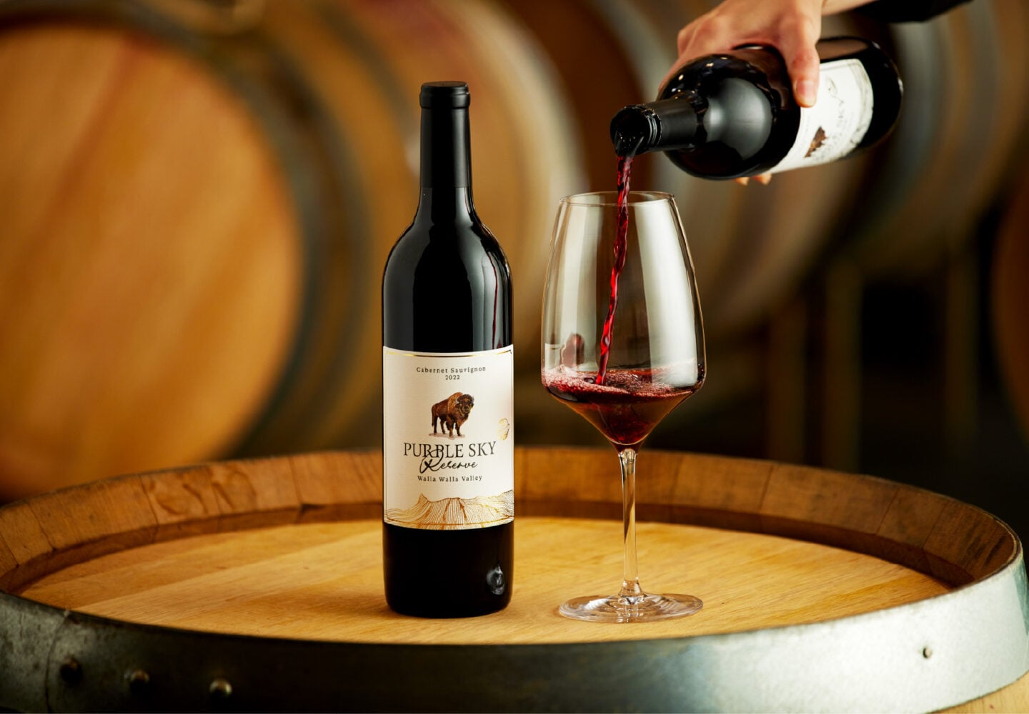 Purple sky winery bottle of 2024 cabernet sauvignon with glass being poured.