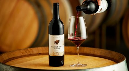 Purple sky winery bottle of 2024 cabernet sauvignon with glass being poured.